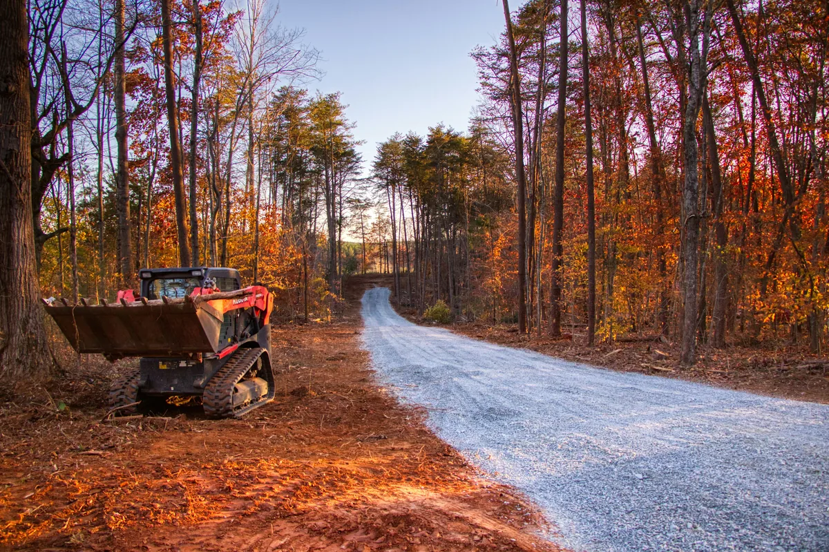 Forestry mulcher clearing a wooded residential lot in Ontario